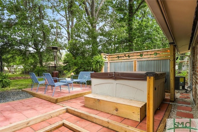512 Winwood Pl, Savannah, GA 31419 - wooden terrace featuring a hot tub, a patio, a fenced backyard, and central air condition unit