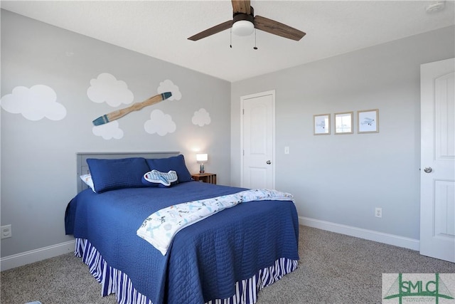 bedroom featuring ceiling fan, baseboards, and carpet