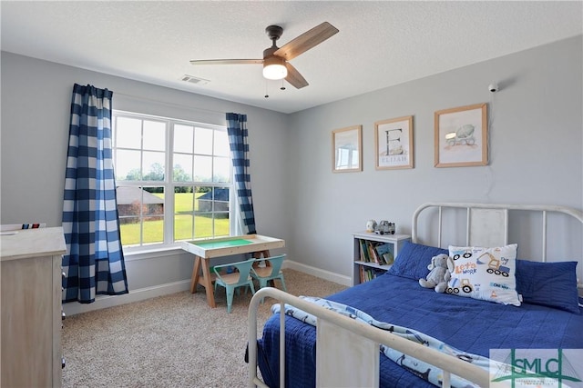 bedroom featuring baseboards, carpet flooring, multiple windows, and visible vents