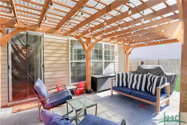 view of patio featuring fence, an outdoor living space, and a pergola