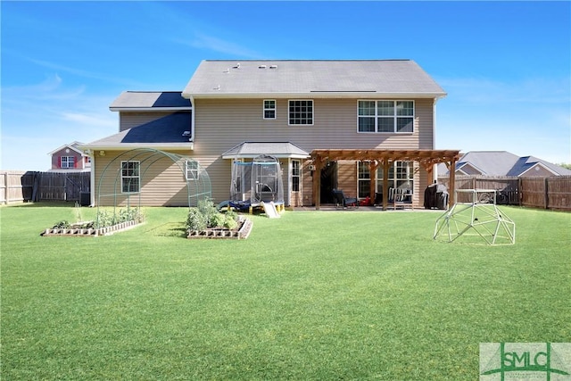 rear view of property with a fenced backyard, a patio area, and a yard