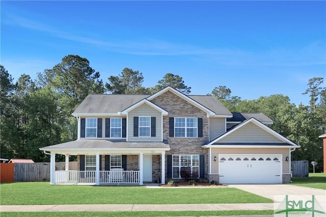 view of front of home featuring fence, a front lawn, an attached garage, driveway, and a porch