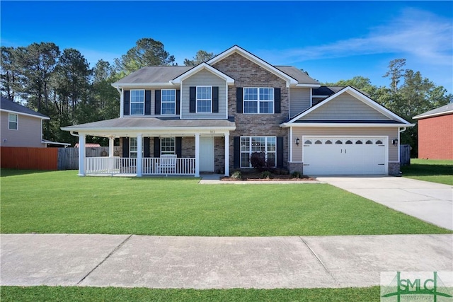 view of front of house with an attached garage, a front lawn, covered porch, and concrete driveway