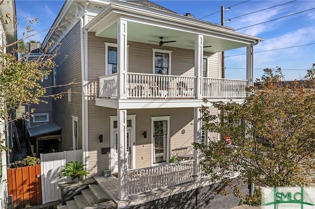 view of front of property with a ceiling fan, a balcony, and covered porch