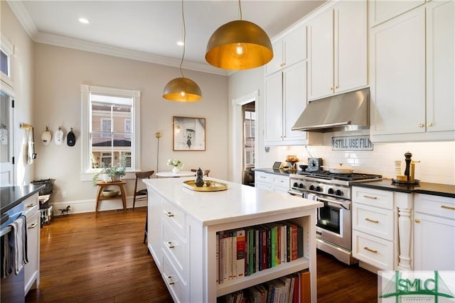kitchen with under cabinet range hood, backsplash, crown molding, stainless steel range, and white cabinetry