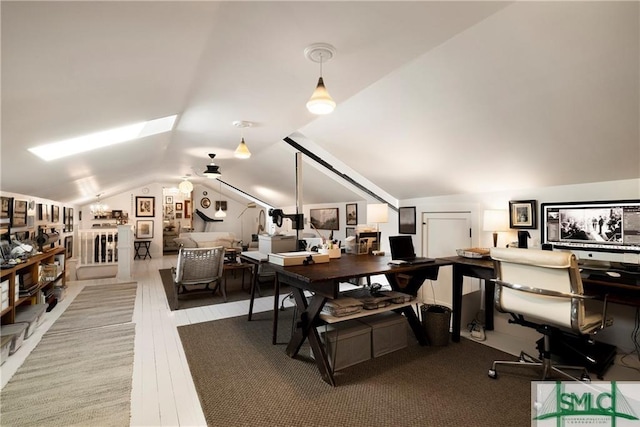 office space with lofted ceiling and wood finished floors