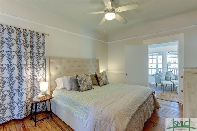 bedroom with a ceiling fan and hardwood / wood-style flooring