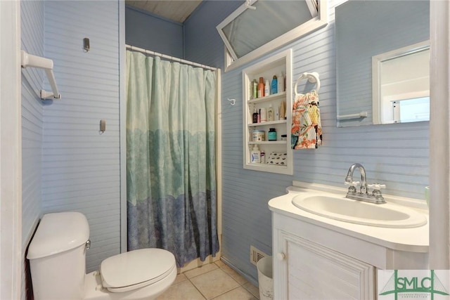 bathroom with tile patterned floors, vanity, curtained shower, toilet, and visible vents