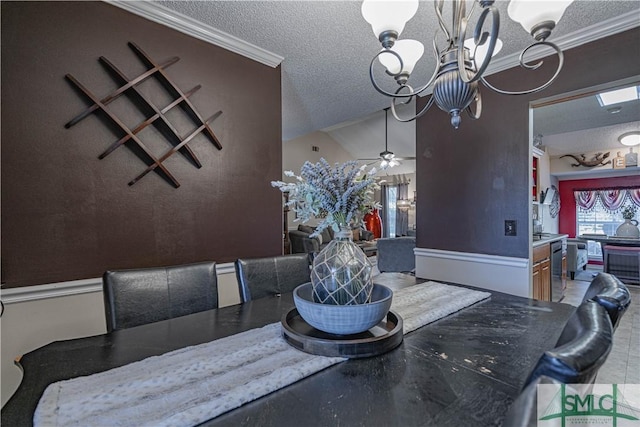 dining area with ornamental molding, ceiling fan with notable chandelier, and a textured ceiling