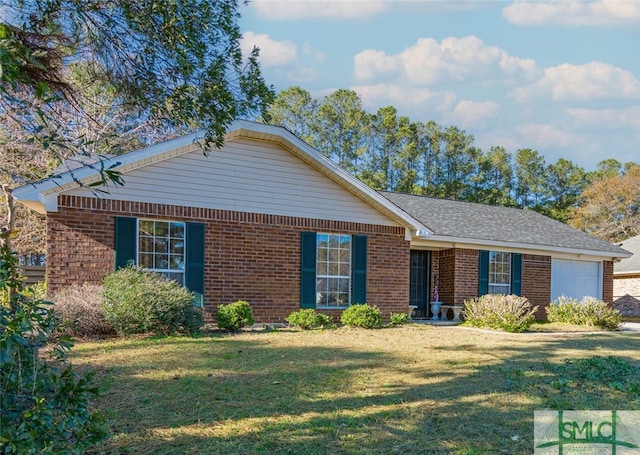 single story home with an attached garage, a front lawn, and brick siding