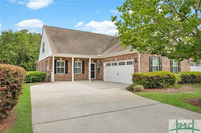 103 Regency Cir, Pooler, GA 31322 - view of front of home featuring brick siding, a garage, driveway, and roof with shingles