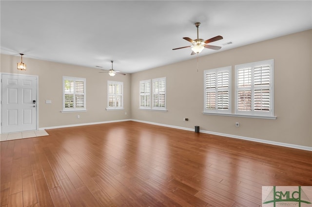 103 Regency Cir, Pooler, GA 31322 - unfurnished living room featuring a ceiling fan, wood finished floors, and baseboards