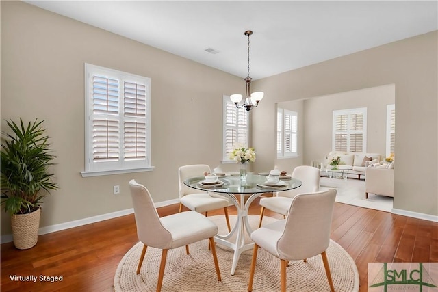 103 Regency Cir, Pooler, GA 31322 - dining room with a chandelier, wood finished floors, and baseboards