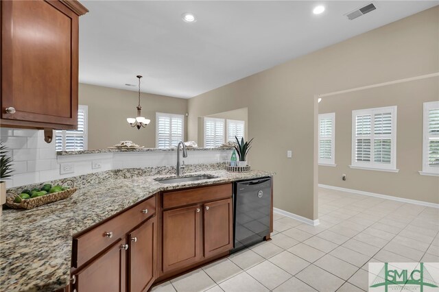 103 Regency Cir, Pooler, GA 31322 - kitchen featuring dishwasher, a sink, a peninsula, a chandelier, and brown cabinetry
