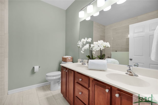 103 Regency Cir, Pooler, GA 31322 - bathroom featuring toilet, double vanity, baseboards, and tiled shower