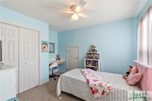 carpeted bedroom with a ceiling fan and a closet