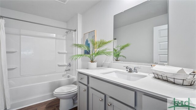 334 Elizabeth Dr, Brunswick, GA 31525 - bathroom featuring vanity, toilet, shower / bath combo, and wood finished floors