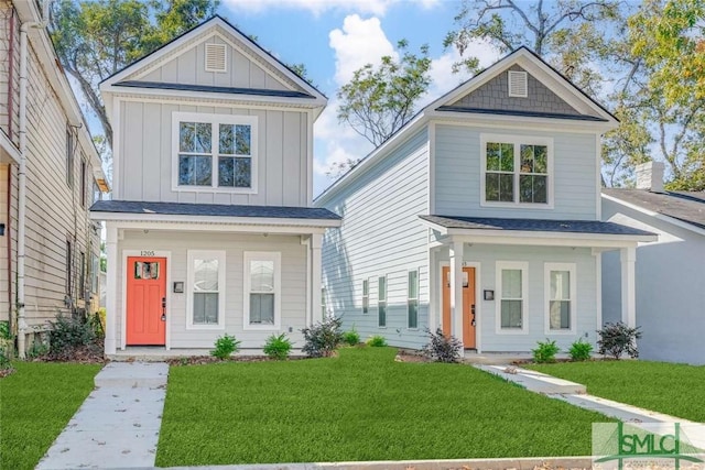 1203 E Bolton St, Savannah, GA 31404 - view of front of home with board and batten siding, a front lawn, and covered porch