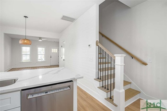 1203 E Bolton St, Savannah, GA 31404 - kitchen featuring dishwasher, visible vents, light wood-style floors, and light stone counters