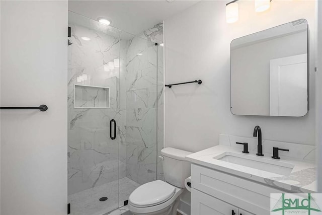 1203 E Bolton St, Savannah, GA 31404 - bathroom featuring a marble finish shower, vanity, and toilet