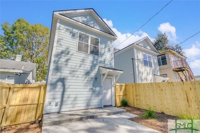 1203 E Bolton St, Savannah, GA 31404 - rear view of house with fence and a patio area