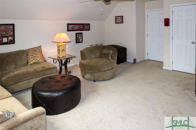 living room featuring a ceiling fan, baseboards, carpet, and vaulted ceiling