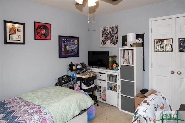 bedroom featuring a ceiling fan, carpet flooring, and a closet