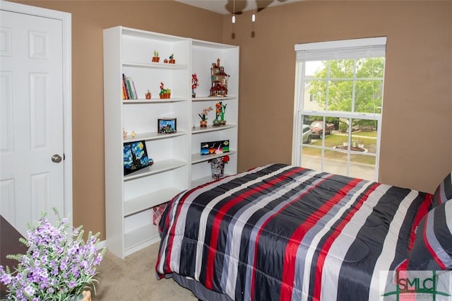 bedroom featuring light colored carpet