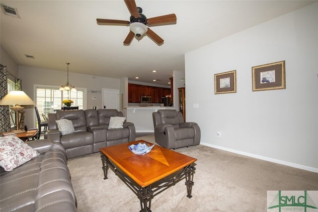 living room featuring baseboards, visible vents, recessed lighting, light colored carpet, and ceiling fan