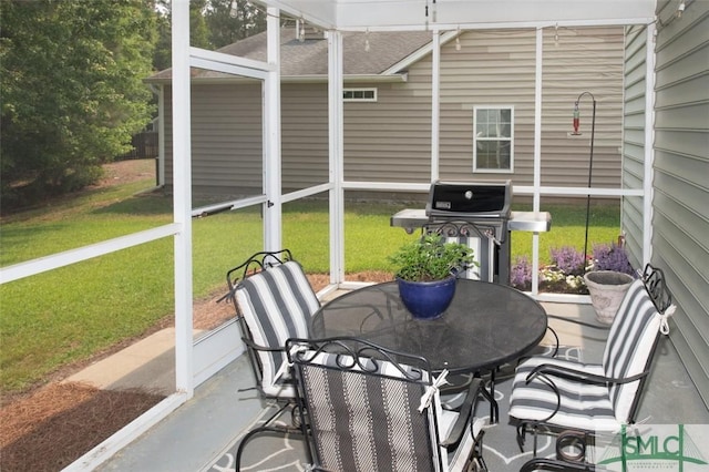 sunroom with outdoor dining space