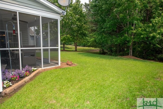 view of yard featuring a sunroom