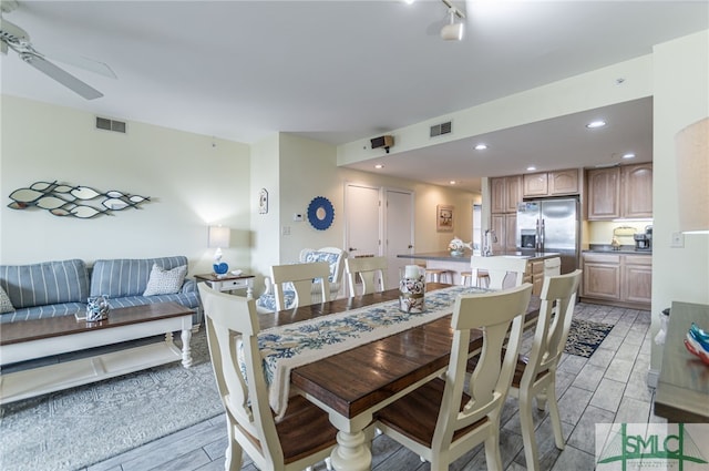 dining room with visible vents and ceiling fan