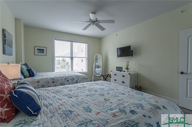 bedroom with baseboards and ceiling fan