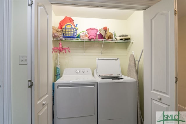 laundry area featuring washing machine and dryer and laundry area