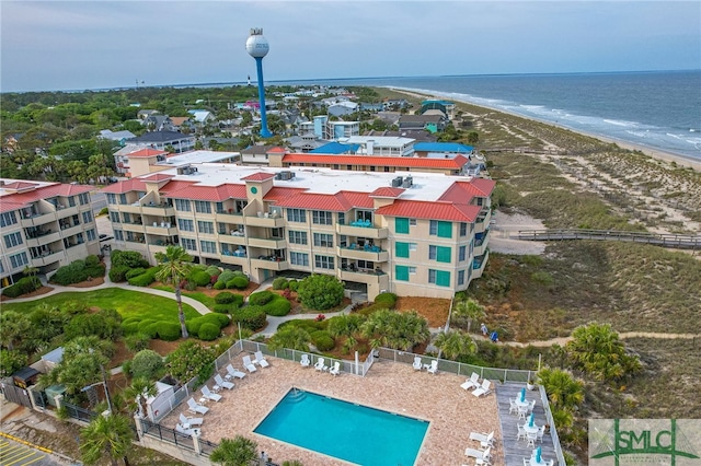 birds eye view of property featuring a view of the beach and a water view