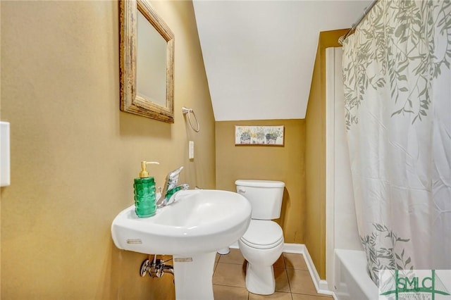 bathroom with tile patterned floors and toilet