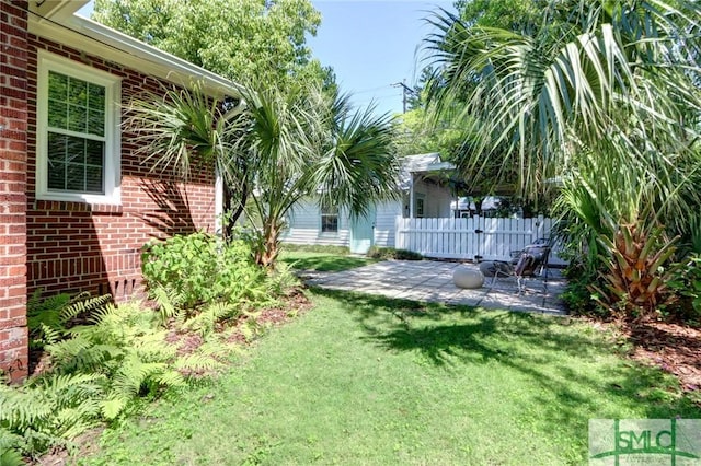 402 E 56th St, Savannah, GA 31405 - view of yard featuring fence and a patio area