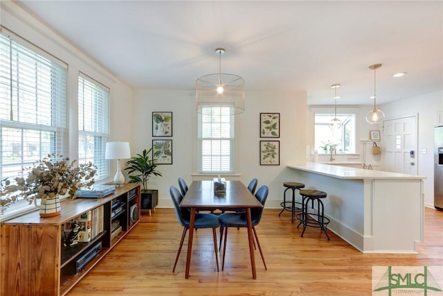 402 E 56th St, Savannah, GA 31405 - dining room with light wood finished floors, plenty of natural light, baseboards, and recessed lighting