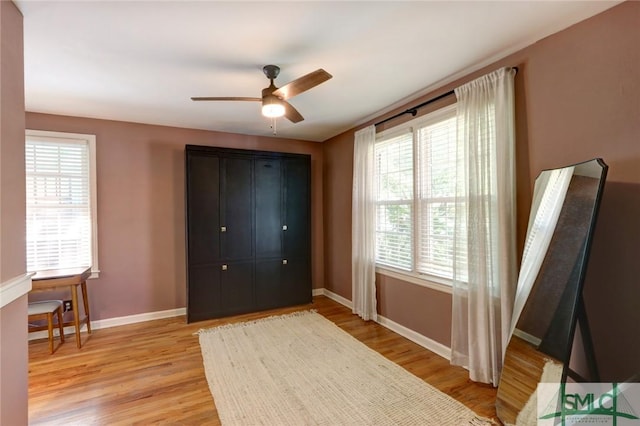 402 E 56th St, Savannah, GA 31405 - bedroom featuring baseboards, a ceiling fan, and light wood-type flooring