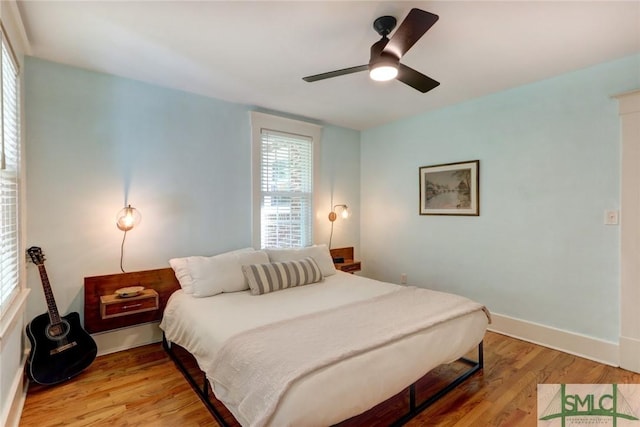 402 E 56th St, Savannah, GA 31405 - bedroom featuring light wood-style floors, a ceiling fan, and baseboards