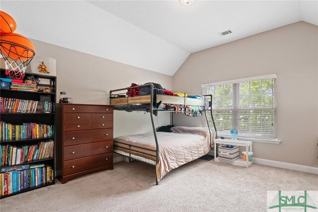 530 Briarcrest Dr NE, Ludowici, GA 31316 - carpeted bedroom featuring lofted ceiling, baseboards, and visible vents