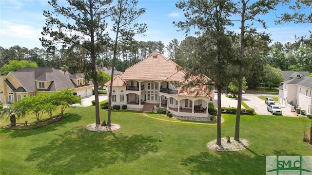 112 Manor Row, Pooler, GA 31322 - back of property featuring a yard, french doors, a tile roof, and a garage