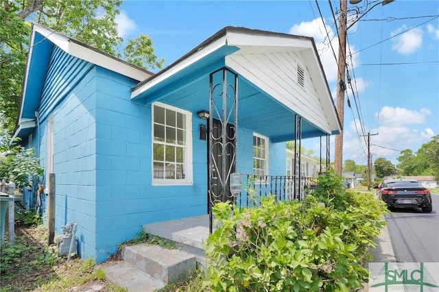 627 W 48th St, Savannah, GA 31405 - view of front of property with covered porch and concrete block siding