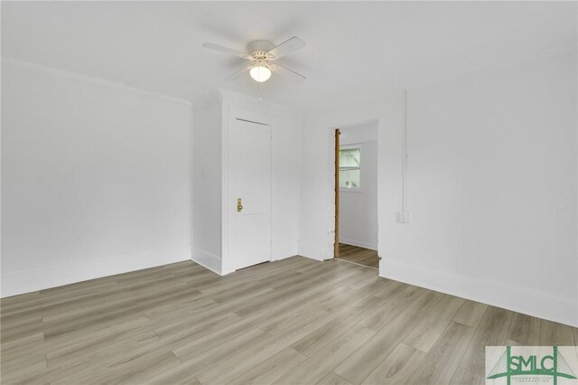 627 W 48th St, Savannah, GA 31405 - empty room with light wood finished floors, baseboards, and ceiling fan