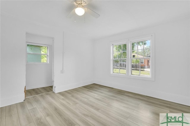 627 W 48th St, Savannah, GA 31405 - empty room featuring plenty of natural light, light wood-style flooring, baseboards, and ceiling fan