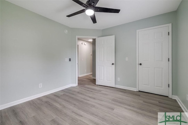 126 Four Oaks Ct, Rincon, GA 31326 - unfurnished bedroom with baseboards, light wood-type flooring, and ceiling fan