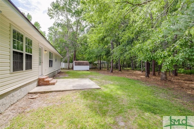 126 Four Oaks Ct, Rincon, GA 31326 - view of yard featuring fence, an outdoor structure, a patio area, and a shed