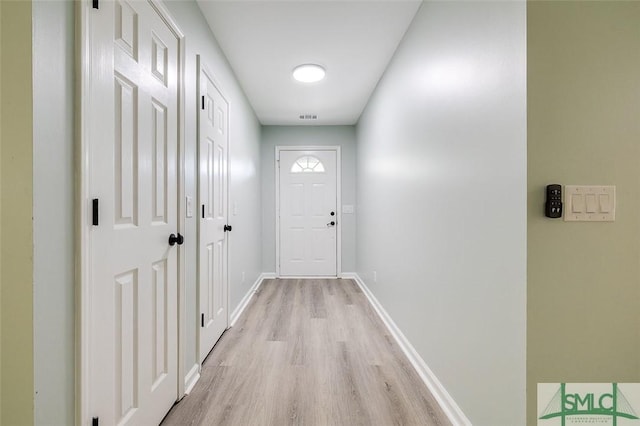 126 Four Oaks Ct, Rincon, GA 31326 - hallway featuring visible vents, baseboards, and light wood-style floors