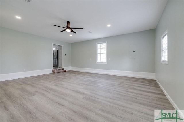126 Four Oaks Ct, Rincon, GA 31326 - unfurnished living room featuring ceiling fan, a wealth of natural light, wood finished floors, and baseboards