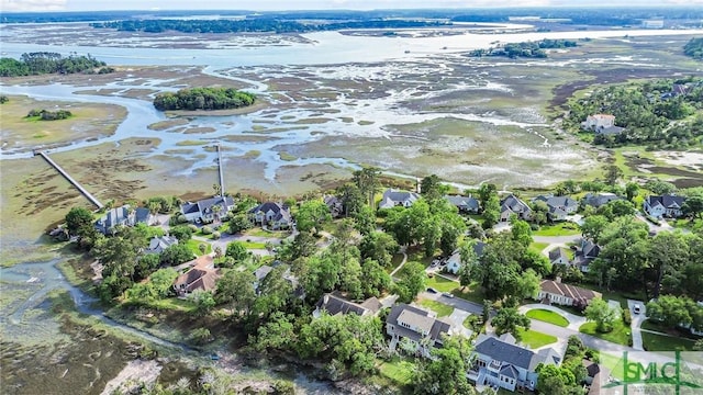 bird's eye view featuring a water view and a residential view